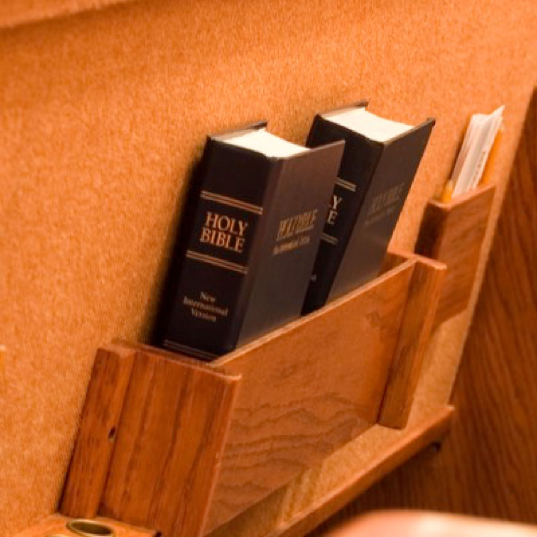 Pew with Bibles and envelopes in back pockets